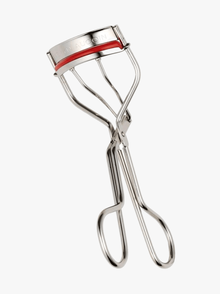 Kevyn Aucoin Eyelash Curler in branded component on a light gray background